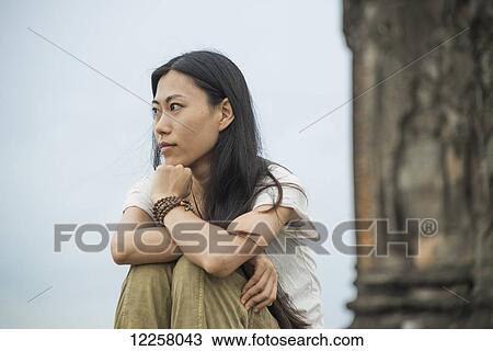 Portrait of a young woman in Phnom Bakheng, ancient buddhist temple from the famous Angkor area; Siem Reap, Cambodia View Large Photo Image Stock Image - Portrait of a young woman in Phnom Bakheng, ancient buddhist temple from the famous Angkor area; Siem Reap, Cambodia. Fotosearch