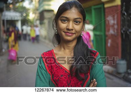 Portrait of a young woman; Kolkata, West Bengal, India View Large Photo Image Picture - Portrait of a young woman; Kolkata, West Bengal, India. Fotosearch