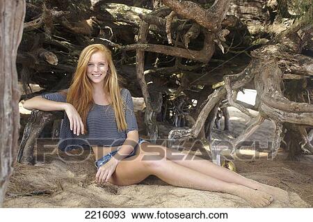 Portrait of a young woman on Tunnel's beach; Kauai, Hawaii, United States of America View Large Photo Image Stock Image - Portrait of a young woman on Tunnel's beach; Kauai, Hawaii, United States of America. Fotosearch