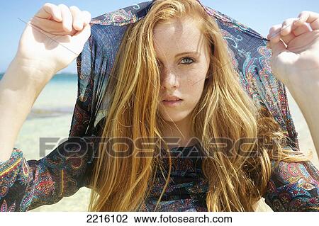 Portrait of a young woman on Tunnel's Beach; Kauai, Hawaii, United States of America View Large Photo Image Stock Image - Portrait of a young woman on Tunnel's Beach; Kauai, Hawaii, United States of America. Fotosearch