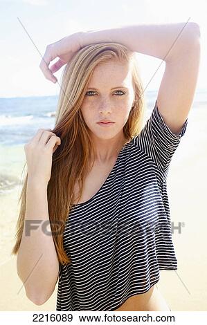 Portrait of a young woman on Tunnel's beach; Kauai, Hawaii, United States of America View Large Photo Image Stock Photo - Portrait of a young woman on Tunnel's beach; Kauai, Hawaii, United States of America. Fotosearch