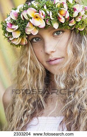 Portrait of a young woman with long blond hair and a floral wreath on her head; Oahu, Hawaii, United States of America View Large Photo Image Picture - Portrait of a young woman with long blond hair and a floral wreath on her head; Oahu, Hawaii, United States of America. Fotosearch