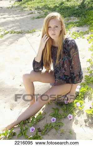 Portrait of a young woman with long red hair on Tunnel's beach; Kauai, Hawaii, United States of America View Large Photo Image Stock Photography - Portrait of a young woman with long red hair on Tunnel's beach; Kauai, Hawaii, United States of America. Fotosearch