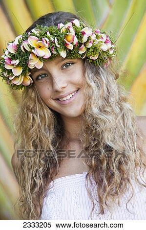 Portrait of a young woman with long blond hair and a floral wreath on her head; Oahu, Hawaii, United States of America View Large Photo Image Stock Photography - Portrait of a young woman with long blond hair and a floral wreath on her head; Oahu, Hawaii, United States of America. Fotosearch