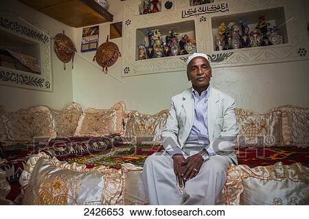 Stock Image - Portrait of an elderly man in traditional home; Harar, Ethiopia. Fotosearch
