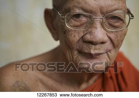 Portrait of an elderly monk; Battambang, Cambodia View Large Photo Image Stock Image - Portrait of an elderly monk; Battambang, Cambodia. Fotosearch