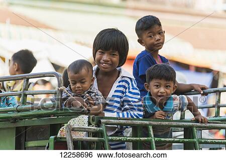 Stock Photograph - Portrait of children around Old Market; Battambang, Cambodia. Fotosearch