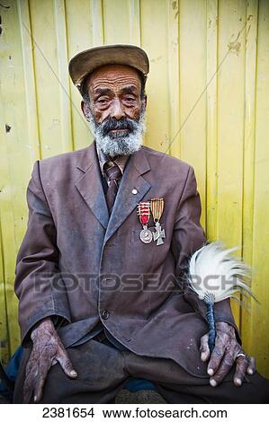 Portrait of elderly man with medals on his chest; Gondar, Ethiopia View Large Photo Image Picture - Portrait of elderly man with medals on his chest; Gondar, Ethiopia. Fotosearch