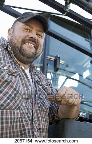 Picture - Portrait Of Farmer On Sprayer. Munson Alberta. Fotosearch