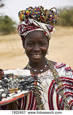 Stock Photo - Portrait Of Girl Selling Jewelry. Fotosearch