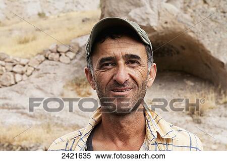 Portrait of local guide called Walking Mehmet; Cappadocia, Turkey View Large Photo Image Stock Photography - Portrait of local guide called Walking Mehmet; Cappadocia, Turkey. Fotosearch