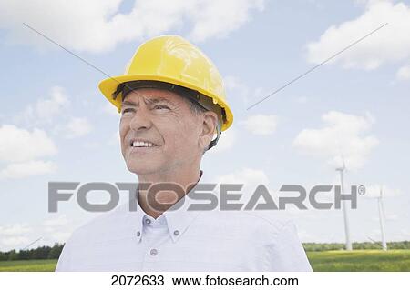 Portrait Of Man In Hard Hat On Wind Farm, Near Shelburne, Ontario View Large Photo Image Stock Image - Portrait Of Man In Hard Hat On Wind Farm, Near Shelburne, Ontario. Fotosearch