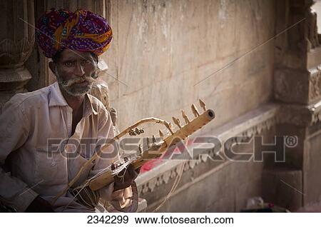 Portrait Of Man With Musical Instrument; India View Large Photo Image Stock Photo - Portrait Of Man With Musical Instrument; India. Fotosearch