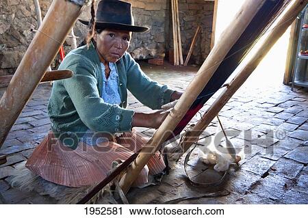 Portrait of mature woman weaving wool on loom, Jatun Yampara Indigenous Community, Chuquisaca Department, Bolivia View Large Photo Image Stock Image - Portrait of mature woman weaving wool on loom, Jatun Yampara Indigenous Community, Chuquisaca Department, Bolivia. Fotosearch