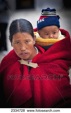 Stock Photo - Portrait Of Mid Adult Woman With Child; Tibet. Fotosearch