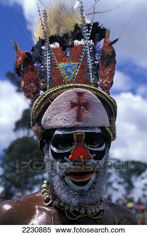 Stock Photography - Portrait Of Native Tribal Man In Face Paint And Headdress, Mt. Hagen Cultural Show, Highlands, Papua New Guinea.. Fotosearch
