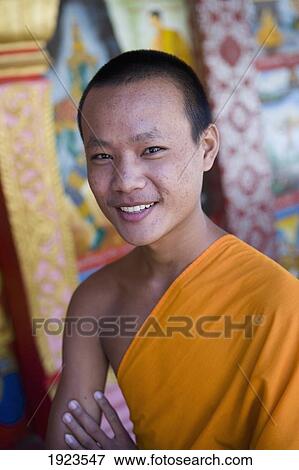 Stock Photo - Portrait Of Novice Monk At Wat Naluang, Luang Prabang, Northern Laos. Fotosearch