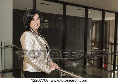 Portrait of professional businesswoman in office setting; Edmonton, Alberta, Canada View Large Photo Image Stock Photo - Portrait of professional businesswoman in office setting; Edmonton, Alberta, Canada. Fotosearch
