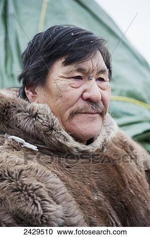 Stock Image - Portrait of senior Inuit man; Churchill, Manitoba, Canada. Fotosearch