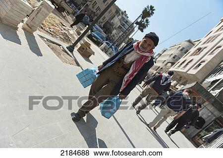 Portrait Of Senior Man Carrying Plastic Bags Of Shopping On Street, Amman, Jordan, Middle East View Large Photo Image Stock Photo - Portrait Of Senior Man Carrying Plastic Bags Of Shopping On Street, Amman, Jordan, Middle East. Fotosearch