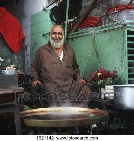 Portrait Of Smiling Food Vendor View Large Photo Image Stock Image - Portrait Of Smiling Food Vendor. Fotosearch