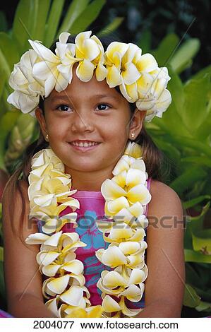 Stock Photo - Portrait Of Smiling Local Girl Wearing Plumeria Haku And Lei, Green Background. Fotosearch