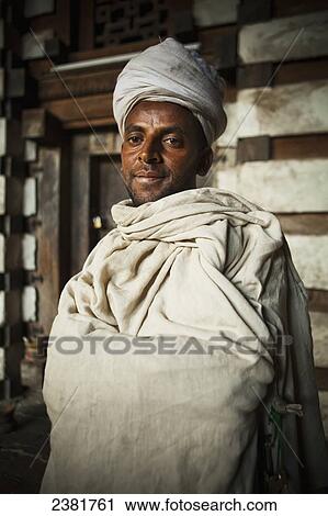 Stock Image - Portrait of the priest at Yemrehanna Kristos Church, near Lalibela; Ethiopia. Fotosearch