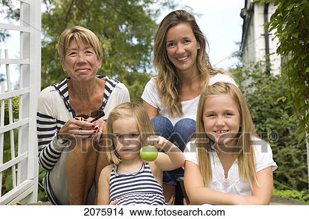 Picture - Portrait Of Three Generations Including Grandmother Mother And Two Daughters; Ontario Canada. Fotosearch