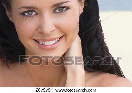 Stock Image - Portrait Of Woman On A Beach, Close Up.. Fotosearch