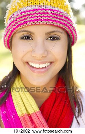 Portrait Of Woman Wearing Winter Clothing, Snowflakes On Cap. View Large Photo Image Stock Image - Portrait Of Woman Wearing Winter Clothing, Snowflakes On Cap.. Fotosearch