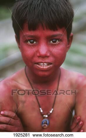 Stock Image - Portrait Of Young Boy Covered In Paint, Holi Festival. Fotosearch