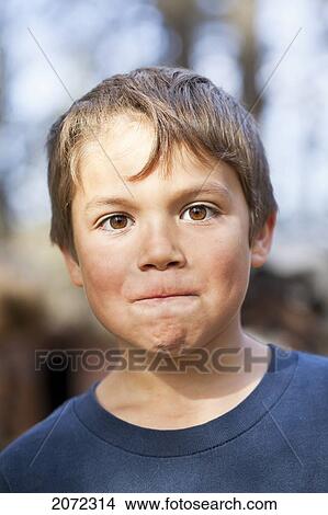 Portrait Of Young Boy Making A Face, Gimli, Manitoba, Canada View Large Photo Image Picture - Portrait Of Young Boy Making A Face, Gimli, Manitoba, Canada. Fotosearch
