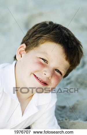 Stock Photo - Portrait Of Young Boy On Beach.. Fotosearch