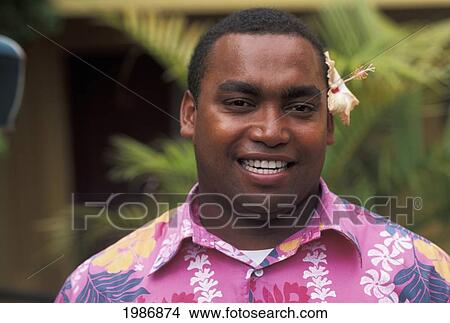 Portrait of young local man in pink flowered shirt; Fiji View Large Photo Image Picture - Portrait of young local man in pink flowered shirt; Fiji. Fotosearch