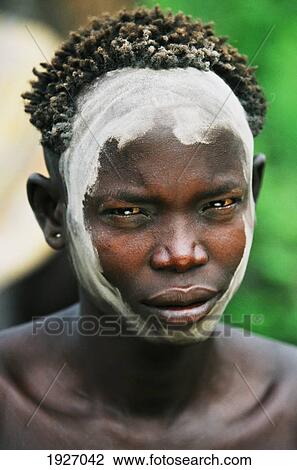 Portrait Of Young Mursi Man Wearing Ceremonial Face Paint During Ceremonial Dueling, Thagine Contest View Large Photo Image Stock Image - Portrait Of Young Mursi Man Wearing Ceremonial Face Paint During Ceremonial Dueling, Thagine Contest. Fotosearch