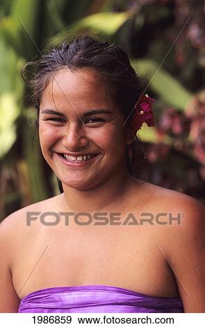 Stock Photo - Portrait of young smiling woman outdoors; Easter Island. Fotosearch