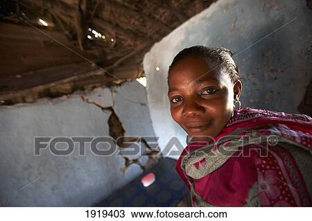 Portrait Of Young Woman Indoors, Tanzania View Large Photo Image Stock Image - Portrait Of Young Woman Indoors, Tanzania. Fotosearch