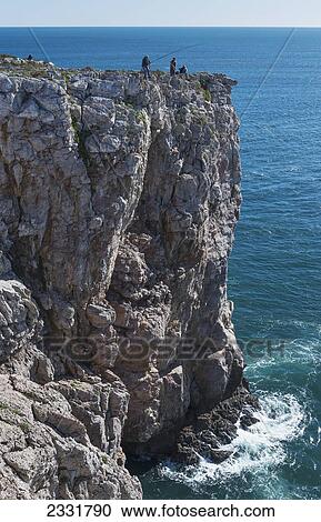 Portugal, Algarve, Distant View; Sagres, People Fishing Off Cliff View Large Photo Image Stock Image - Portugal, Algarve, Distant View; Sagres, People Fishing Off Cliff. Fotosearch