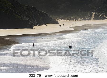 Portugal, Carrapateira, Distant View; Playa Do Amado, Surfers In Water And People Walking On Beach View Large Photo Image Stock Image - Portugal, Carrapateira, Distant View; Playa Do Amado, Surfers In Water And People Walking On Beach. Fotosearch