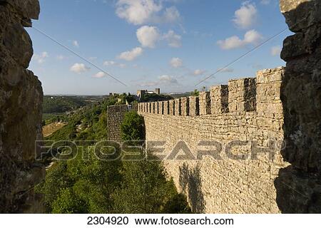 Portugal, Estremadura Province, Obidos is a 12th CE romantic medieval village with a castle and rampart walls; Obidos View Large Photo Image Stock Image - Portugal, Estremadura Province, Obidos is a 12th CE romantic medieval village with a castle and rampart walls; Obidos. Fotosearch