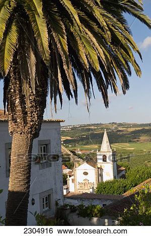 Stock Photograph - Portugal, Estremadura Province, Obidos is a 12th CE romantic medieval village with a castle and rampart walls; Obidos. Fotosearch