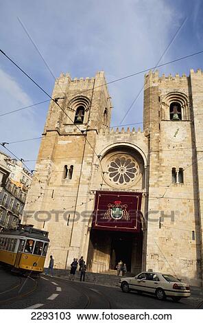 Stock Image - Portugal, Tram passing Se Cathedral; Lisbon. Fotosearch