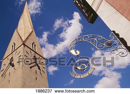 Stock Photo - Post Sign With Clock Tower In Zermatt. Fotosearch