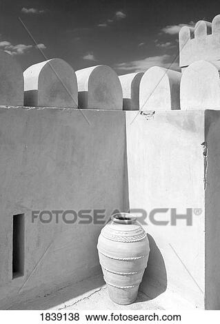 Stock Photo - Pottery Urn Inside Crenellated Walls Of Nakhal Fort; Nakhal, Hajar, Oman. Fotosearch