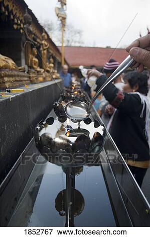 Pouring Oil Into Candles At Buddhist Temple, Chiang Mai, Thailand View Large Photo Image Stock Photo - Pouring Oil Into Candles At Buddhist Temple, Chiang Mai, Thailand. Fotosearch
