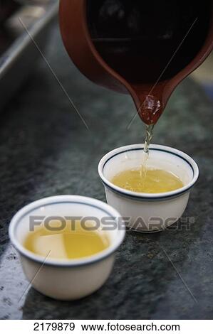 Stock Photo - Pouring tea Maokong tea plantation Taipei Taiwan. Fotosearch