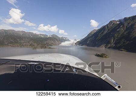 Stock Photography - POV view from the cockpit of Grewingk Glacier and Kachemak Bay, Kachemak Bay State Park, Southcentral Alaska, Summer. Fotosearch