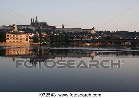 Stock Image - Prague Castle Reflected In The Vltava River, Prague, Czech Republic. Fotosearch
