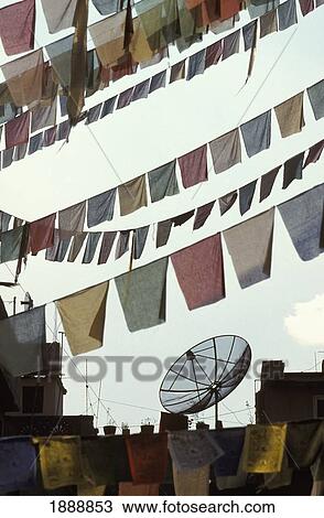 Stock Image - Prayer Flags And Satellite Dish.. Fotosearch