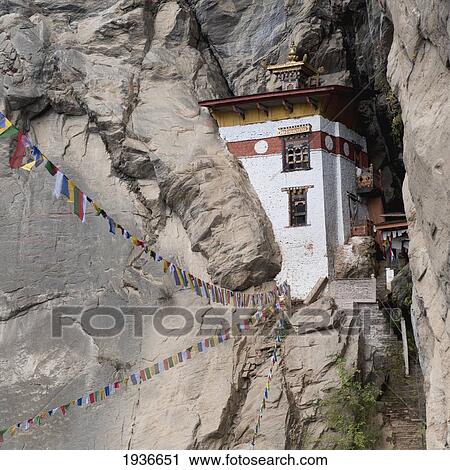 Prayer Flags Hanging In Front Of Tiger's Nest Monastery; Paro District Bhutan View Large Photo Image Stock Image - Prayer Flags Hanging In Front Of Tiger's Nest Monastery; Paro District Bhutan. Fotosearch